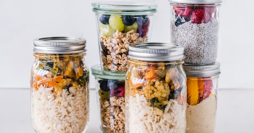 Glass jars filled with prepared meals for the week