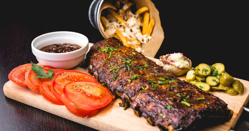 Organized meal prep containers with colorful vegetables, grains, and proteins